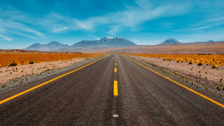 lone road going to mountains